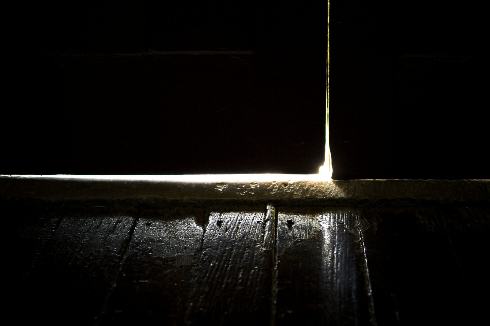 black wooden floor with white light